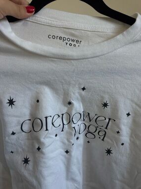 Cropped CorePower Yoga White Graphic Tee with Black Star Print